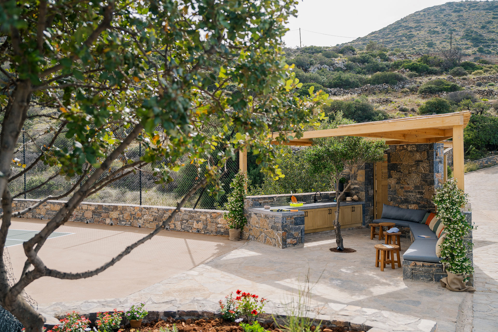 elounda-villas_villa_crete-greece_exterior-tennis-court-seating.jpg