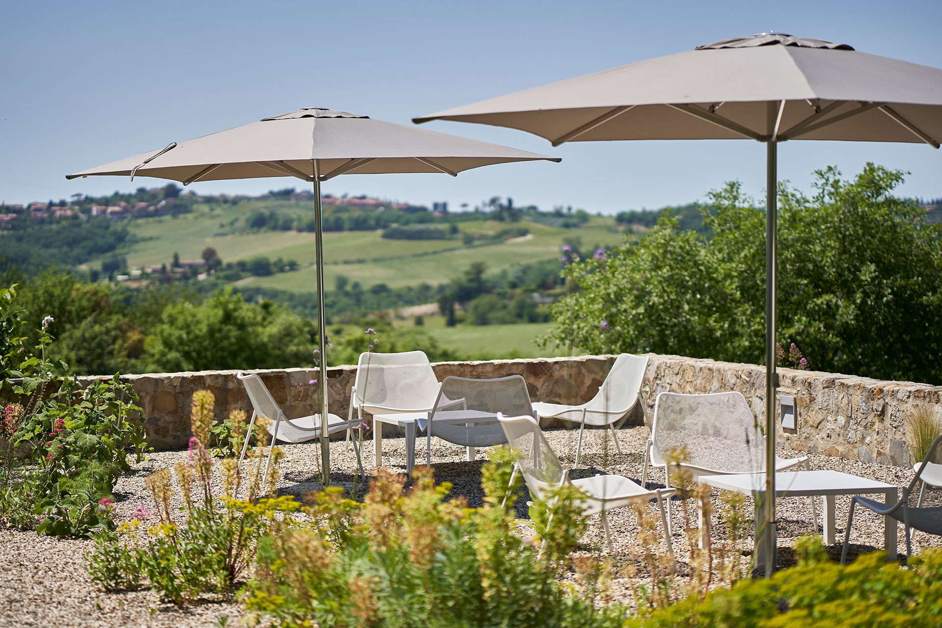 casale-di-cellole_farmhouse_tuscany-italy_exterior-terrace-seating.jpg