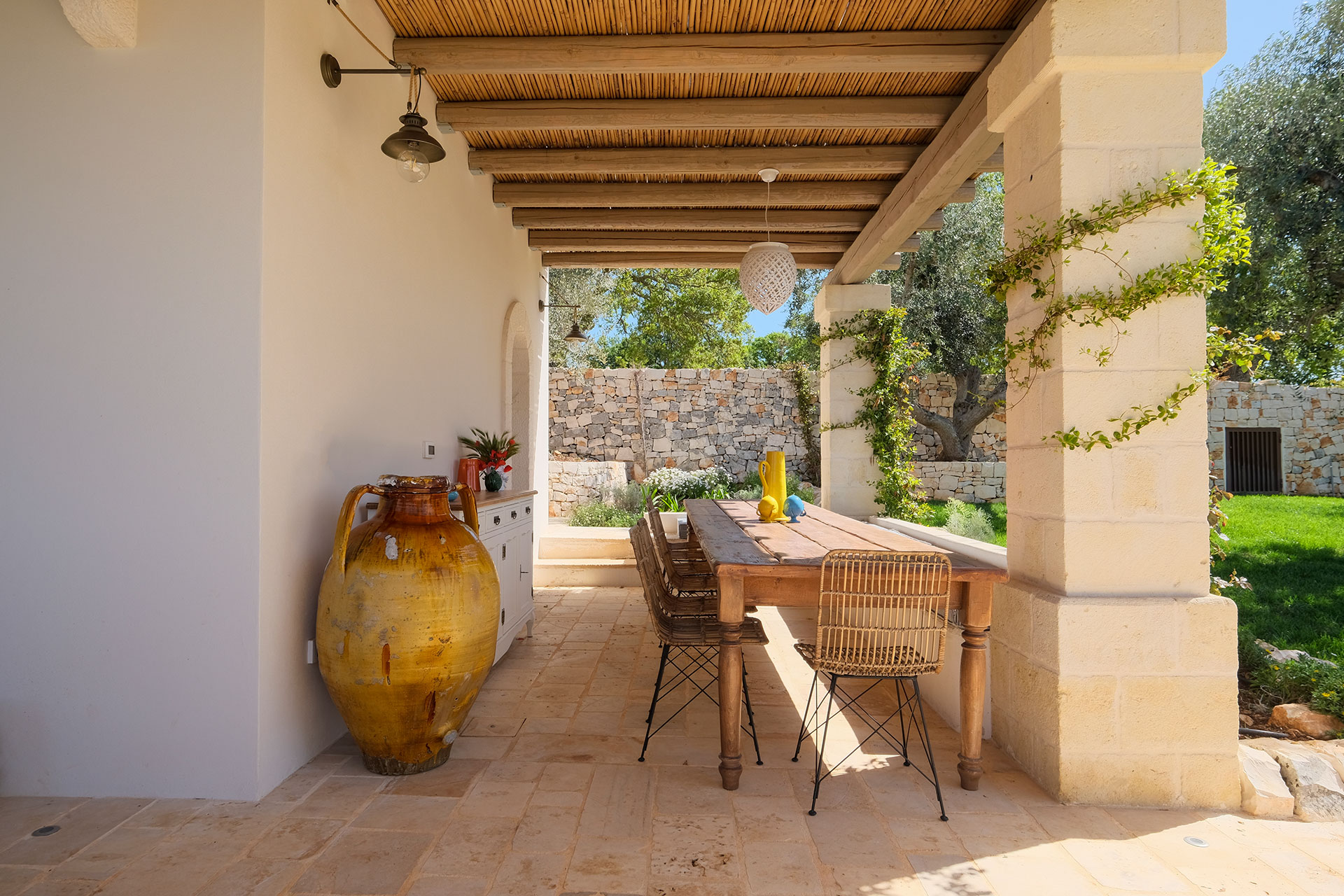 trulli-cantalanotte_trullo-puglia-italy-exterior-terrace-table.jpg