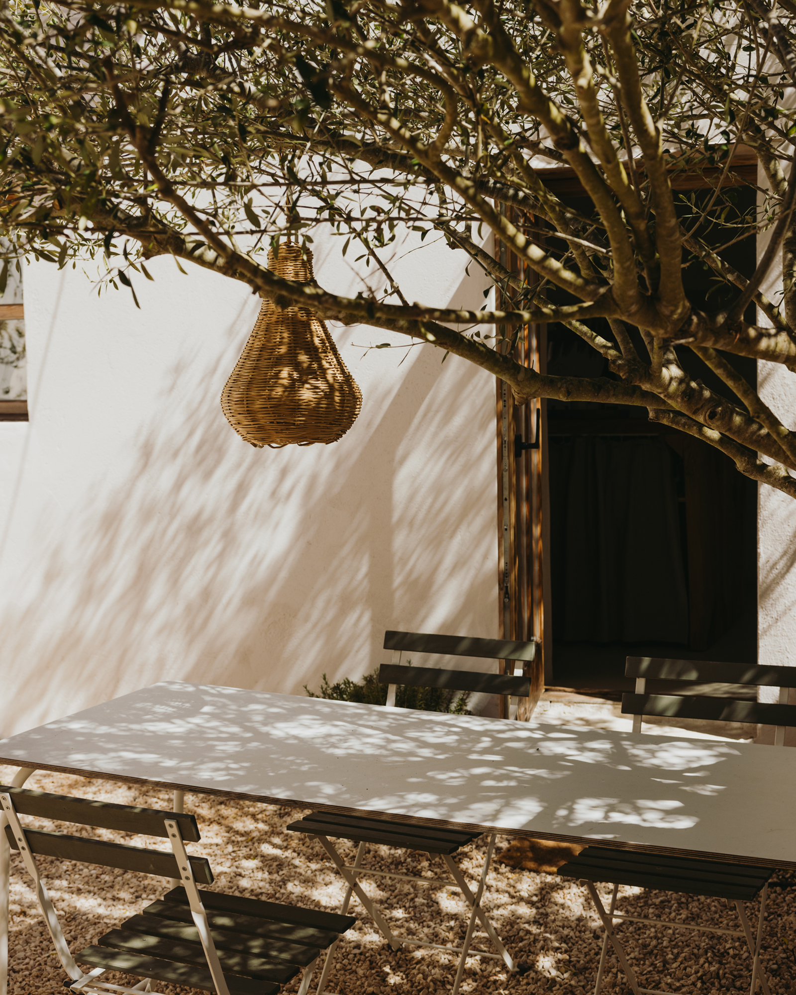 maybe-october_farmhouse_faro-district-portugal_exterior-table-tree.jpg