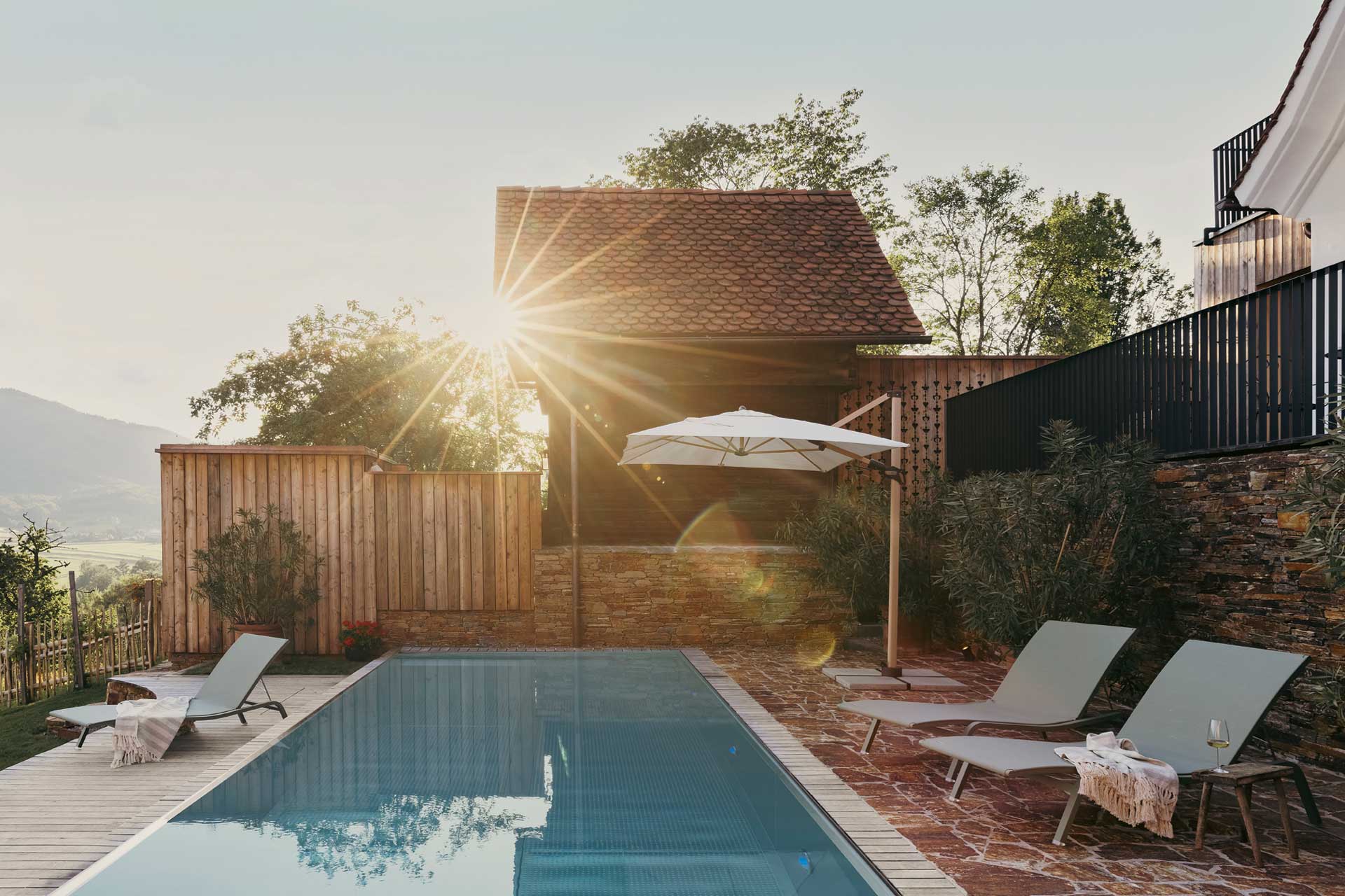 am-wildbachberg_house_steiermark-austria_exterior-pool-sunset.jpg