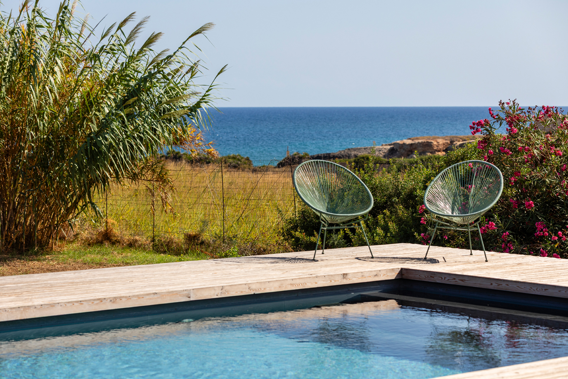 cala-due-seafront-villa_villa_sicilia-italy_exterior-chairs.jpg
