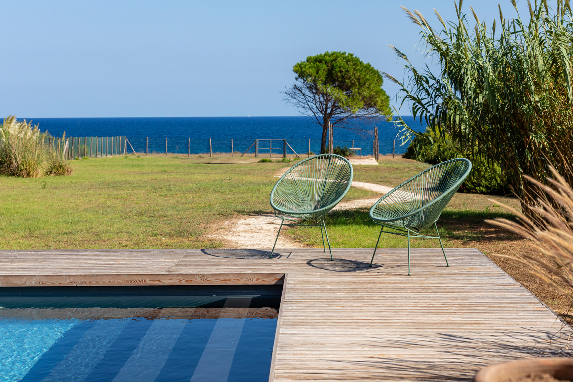 cala-due-seafront-villa_villa_sicilia-italy_exterior-pool-chairs.jpg
