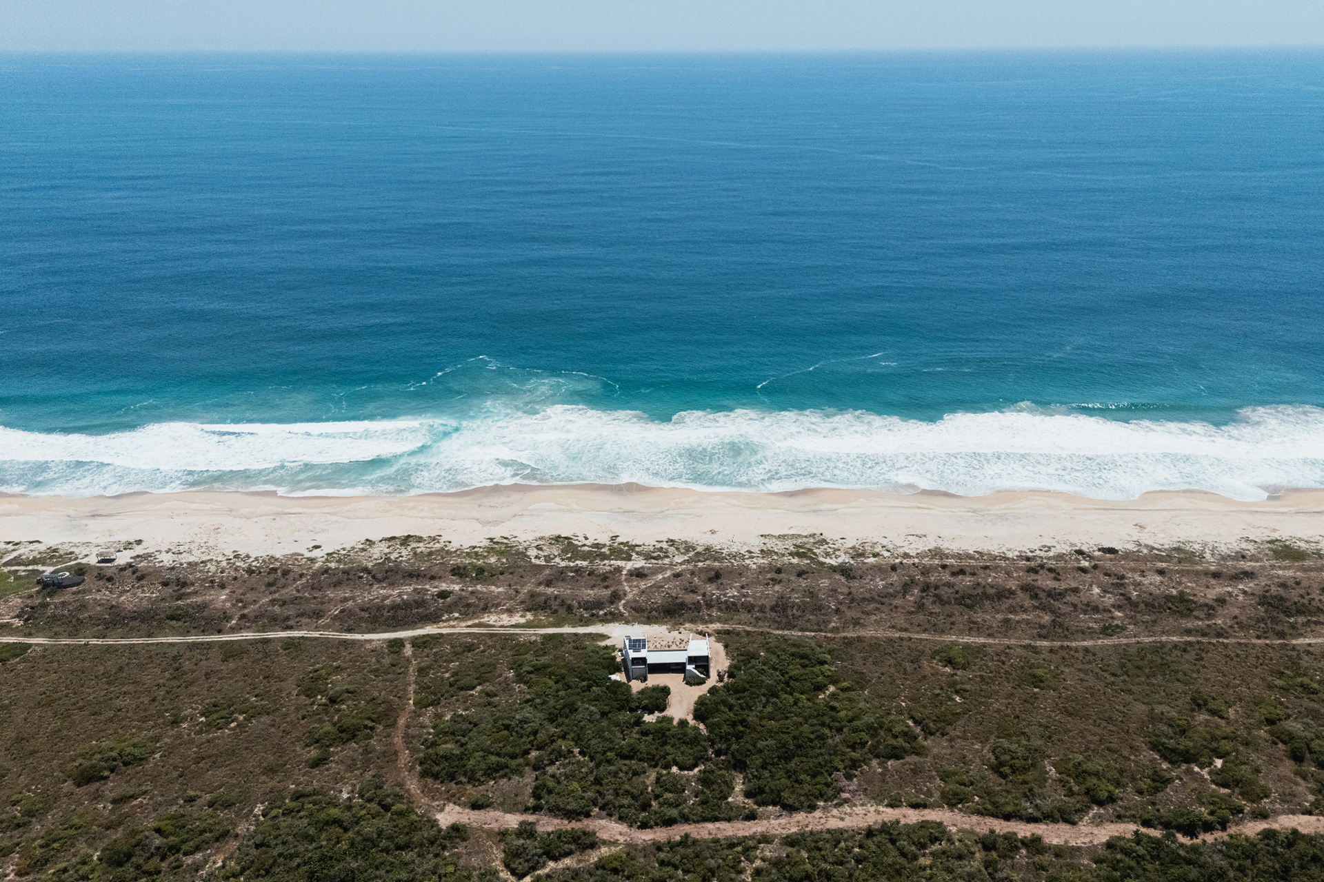 tropical-brutalist-oceanfront-villa_villa_oaxaca-mexico_exterior-drone.jpg