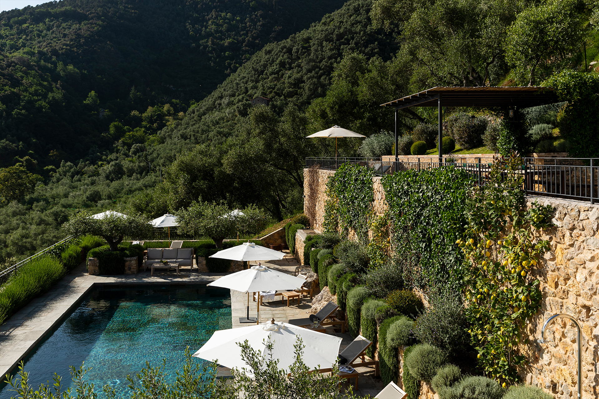 villa-tomeoni_farmhouse_tuscany-italy_exterior-pool-view.jpg
