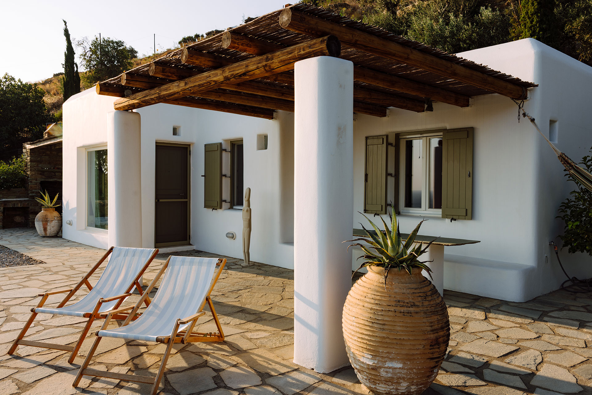 villa-riza_villa_andros-greece_exterior-facade-chairs.jpg