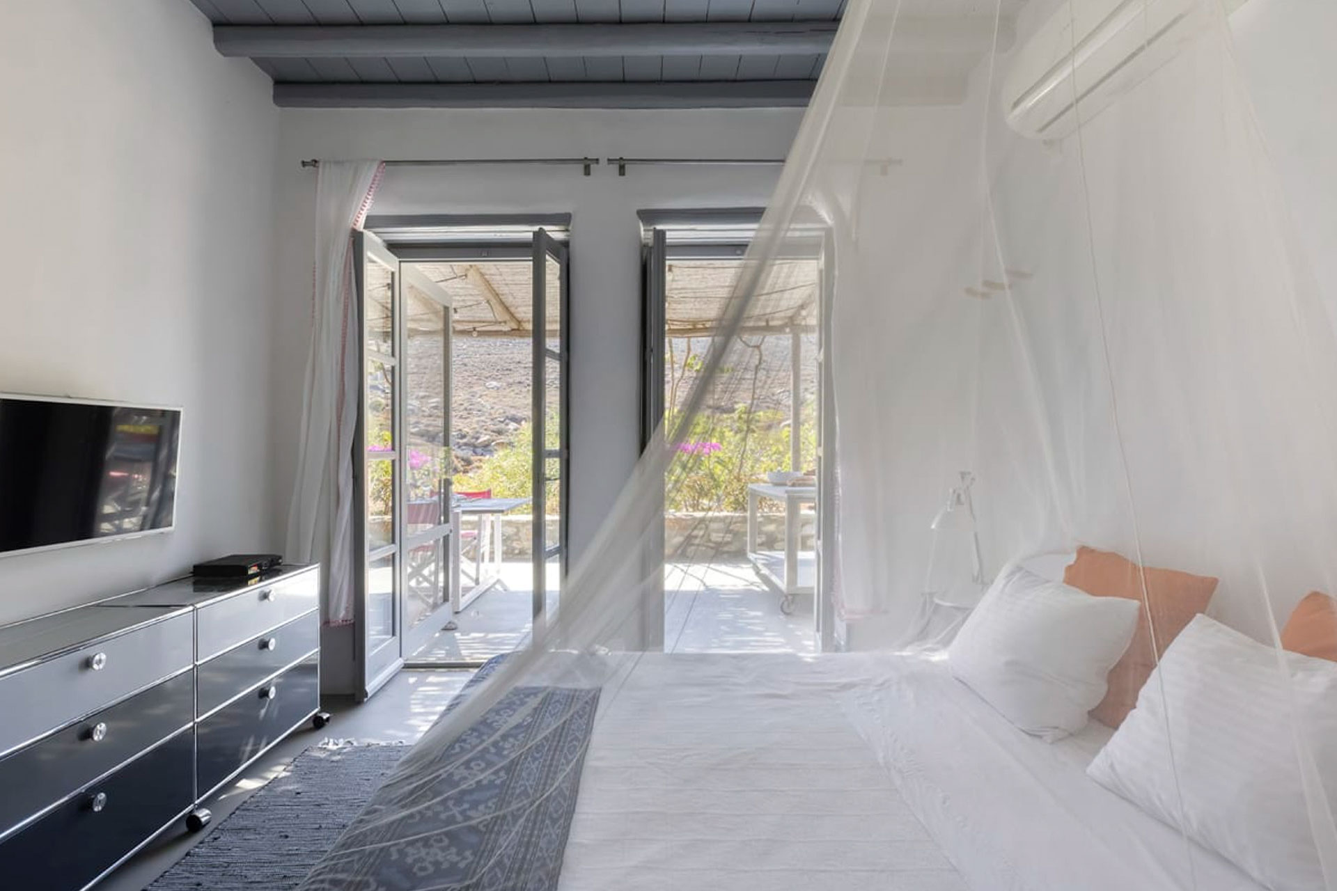 serifos-beach-front-villa_villa_cyclades-greece_interior-bedroom-window.jpg