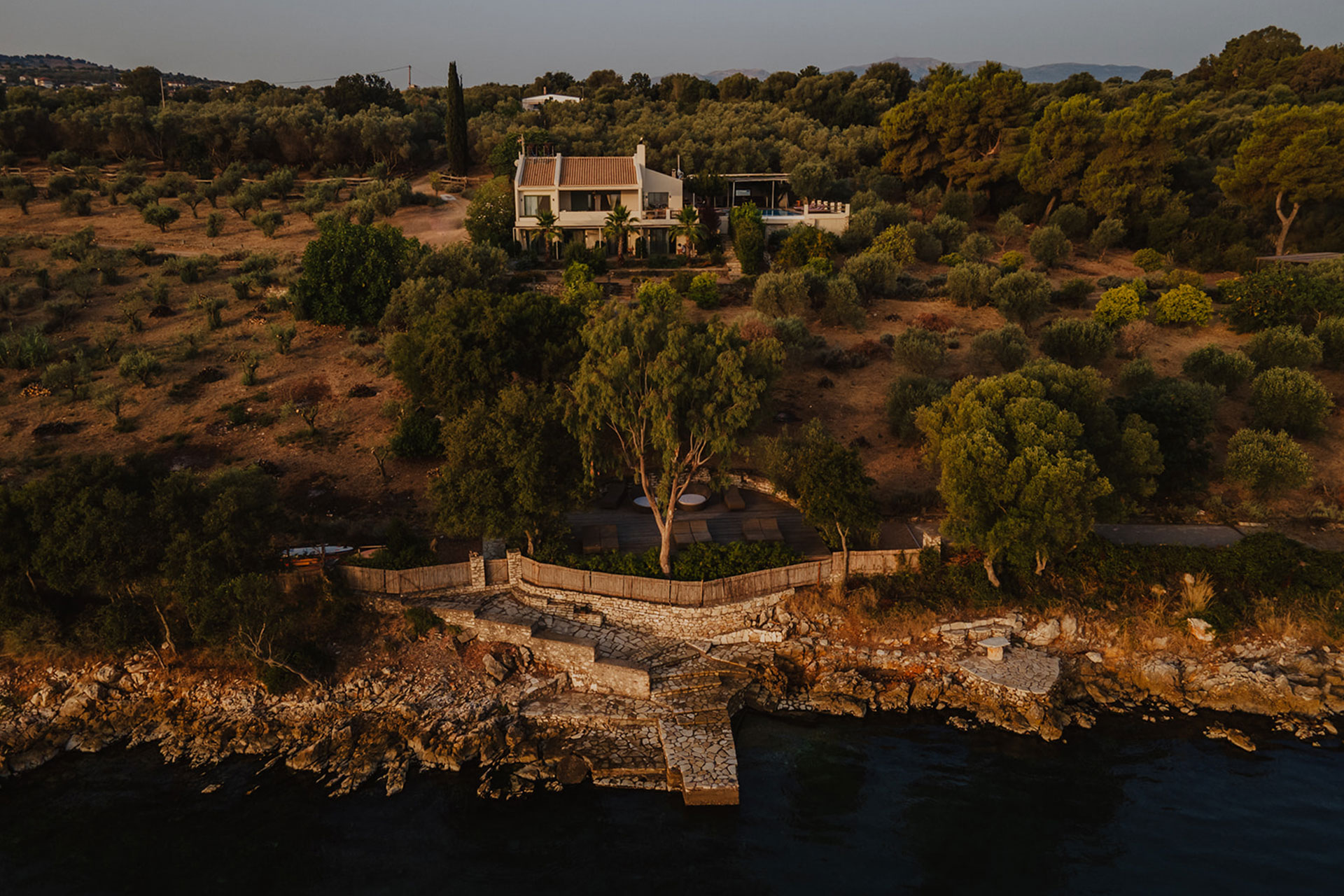 villa-amalia_villa_sparto-greece_exterior-drone-sunset.jpg